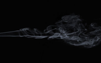 Close-up of smoke against black background