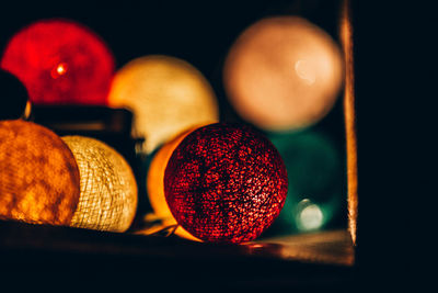 Close-up of illuminated christmas lights on table