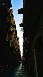 Street amidst residential buildings against sky