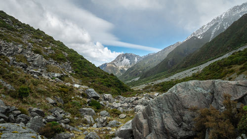 Scenic view of mountains against cloudy sky