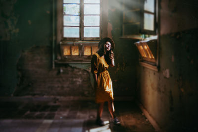 Girl in derelict building with beautiful light