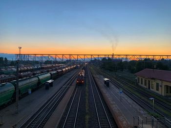 High angle view of railroad tracks against sky during sunset