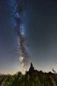 Low angle view of mountain against sky at night