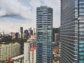 Modern buildings in city against sky