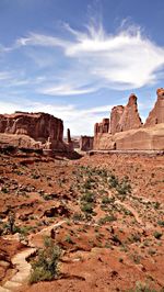 Scenic view of mountain against cloudy sky