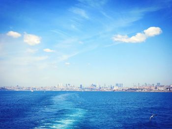 Scenic view of sea and buildings against sky