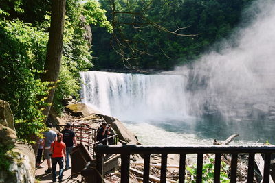 People in waterfall