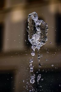 Close-up of water splashing against blurred background