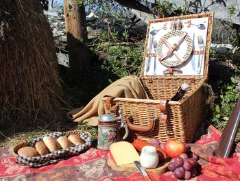 Various fruits in basket on table