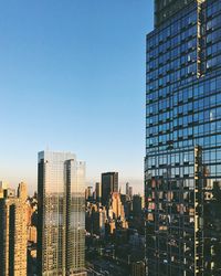 View of skyscrapers against blue sky