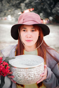 Portrait of woman wearing hat