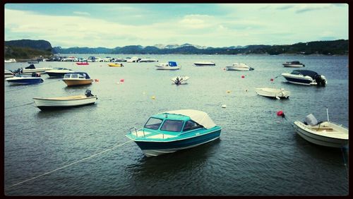 Boats moored in sea