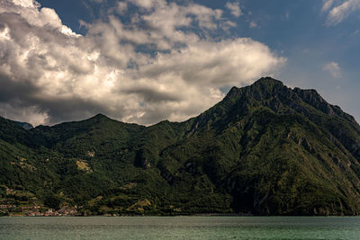 Scenic view of mountains and sea against sky