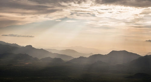 Scenic view of mountains against sky during sunset