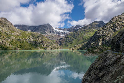 The fellaria glacier is reflected in the campomoro dam in valmalenco.