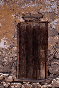 Closed wooden door of old building