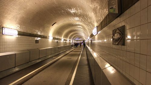 Illuminated tunnel at subway station