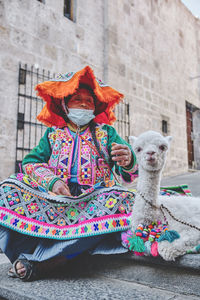 Portrait of woman with teddy bear