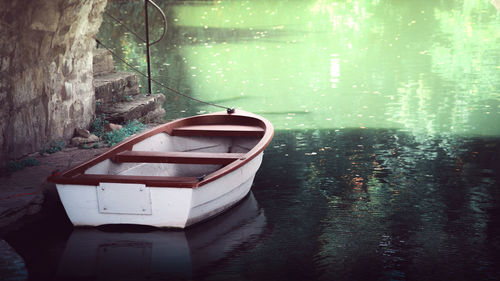 Boat moored on lake