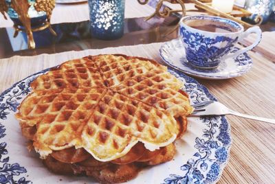 Close-up of waffles and coffee on table