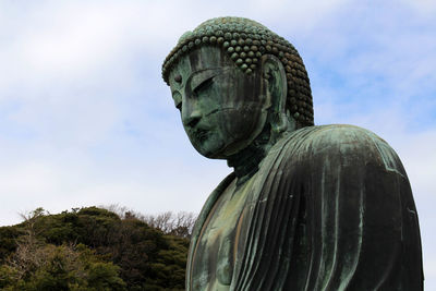 Close-up of statue against sky