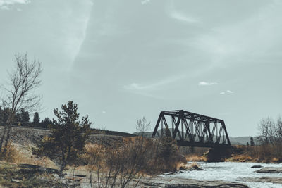 Bridge over river against sky