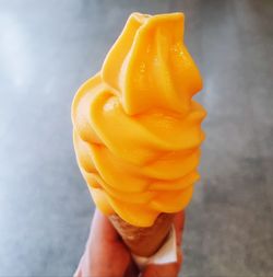 Close-up of hand holding ice cream