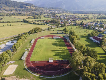 Aerial view of a football field in countryside near bled lake in upper carniola region, slovenia.