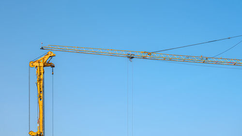 Rotary drilling rigs and crane on blue sky