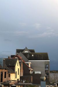 Buildings in city against sky