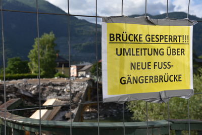 Close-up of warning sign on built structure