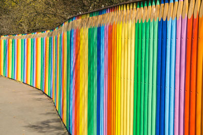 Multi colored pencils in row