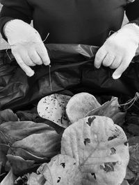 Close-up of man working on barbecue grill