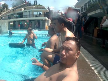 People enjoying in swimming pool