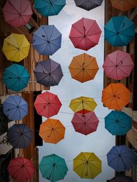 Low angle view of multi colored umbrellas