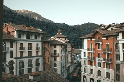 Houses in town against clear sky