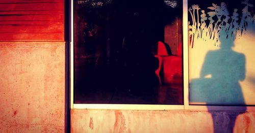 Reflection of window on glass door