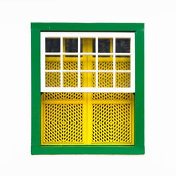 Close-up of yellow window over white background