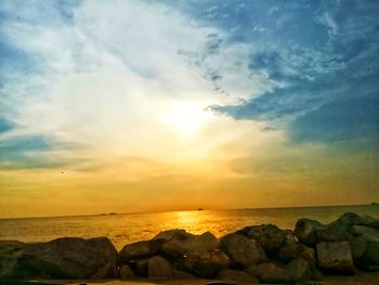 Scenic view of sea against sky at sunset