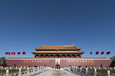 View of temple against clear blue sky