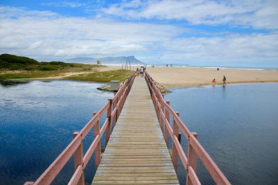 Pier over sea against sky