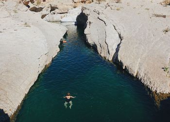 High angle view of woman swimming in lake