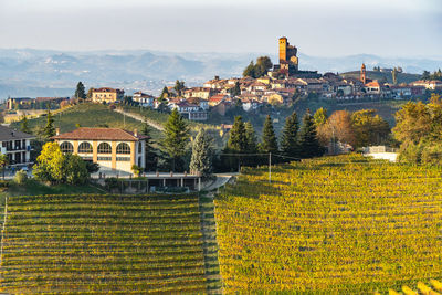 The village of serralunga with its castle and vineyards, langhe, piedmont, italy