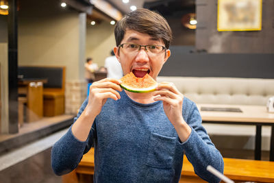 Portrait of man eating food