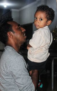 Side view of father and son