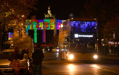 Illuminated city street at night