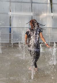 Full length of man jumping in water