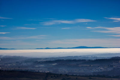 Scenic view of landscape against blue sky