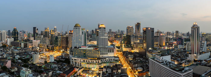 High angle view of modern buildings in city against sky