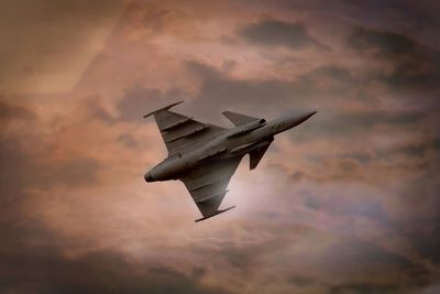 Low angle view of airplane flying in sky